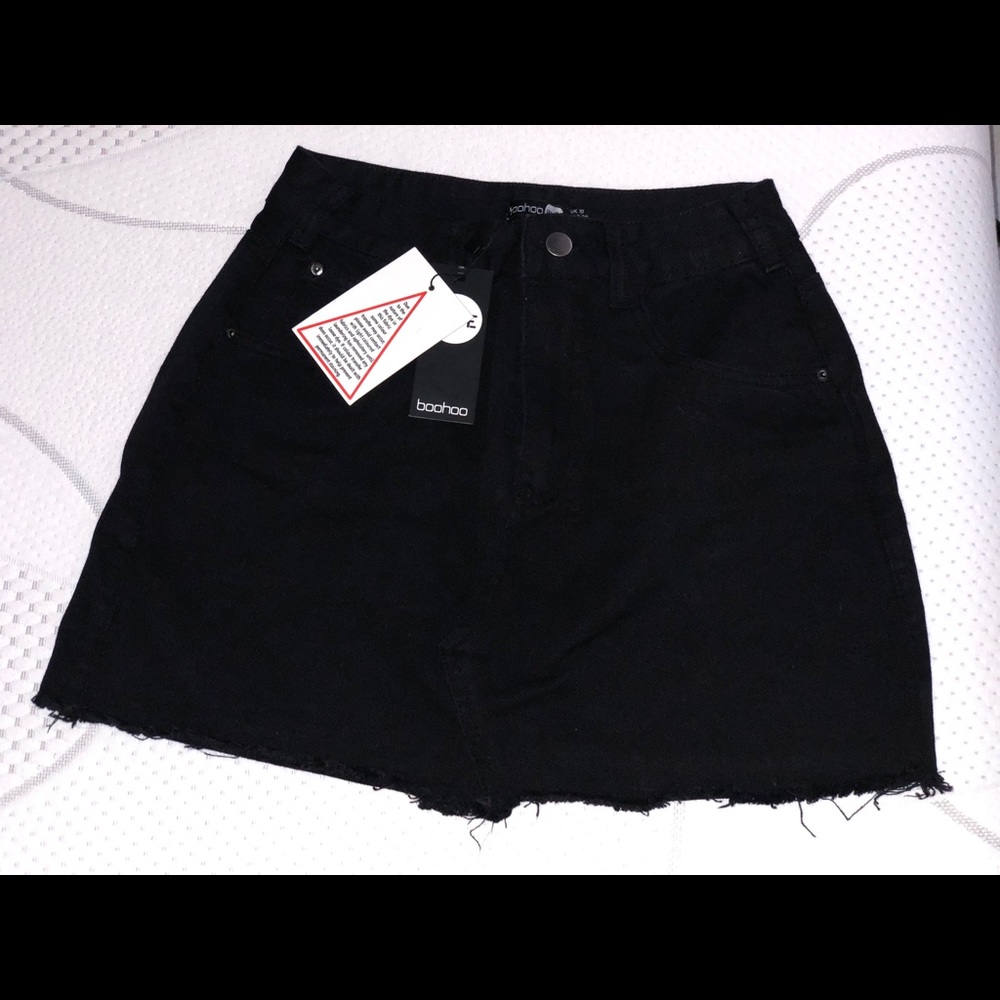 Black distressed denim mini skirt